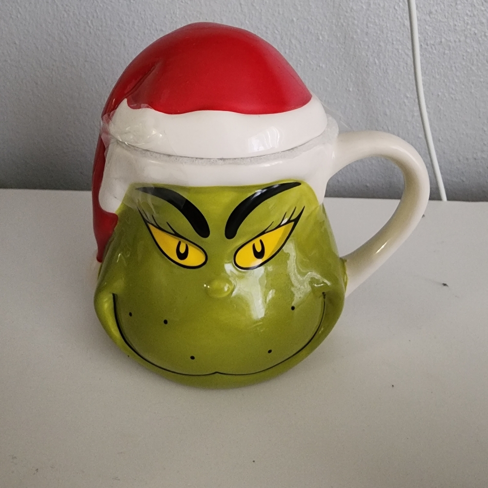 Grinch mug with santa hat